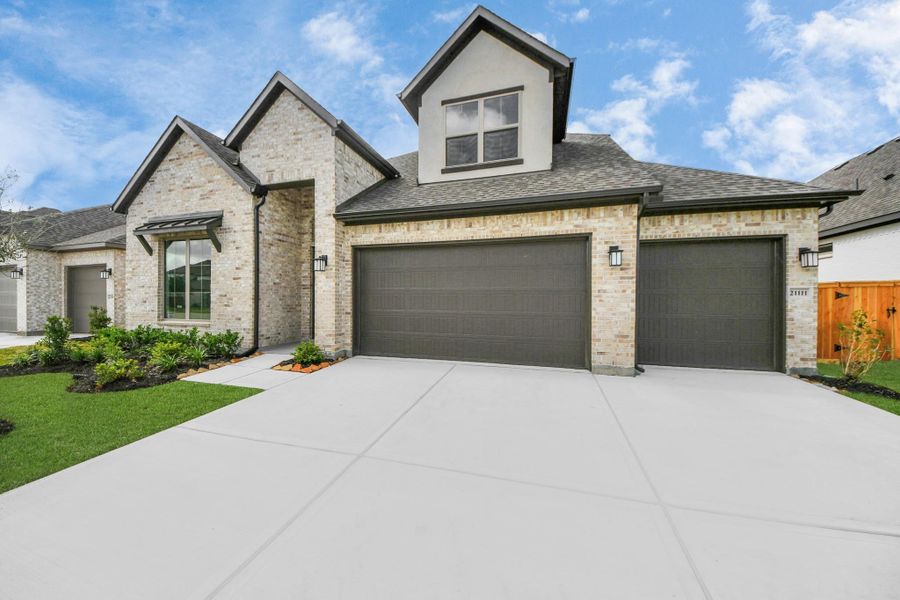 Front exterior of a new home in Marvida, Cypress, TX, highlighting curb appeal (Image 19).
