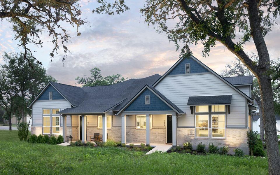 View of front of house with brick siding and a front yard