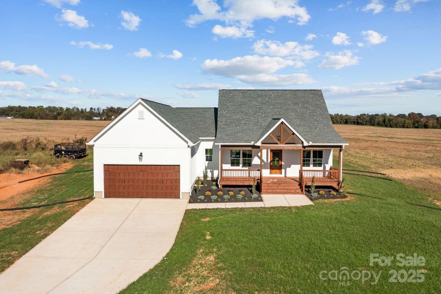 Front exterior of a new home in , Olin, NC, highlighting curb appeal (Image 2). Front exterior of a new home in , Olin, NC, highlighting curb appeal (Image 2).