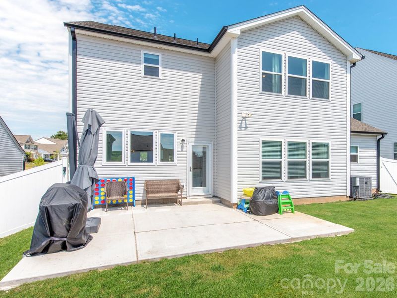 Exterior details and patio area of a home in Sutter's Mill II, Troutman (Image 23).