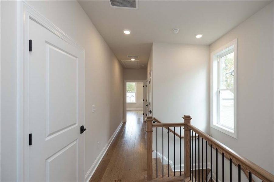 Hall with dark wood-type flooring