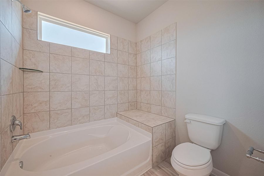 Furnished interior view inside a new home in Sunterra, Katy (Image 5).