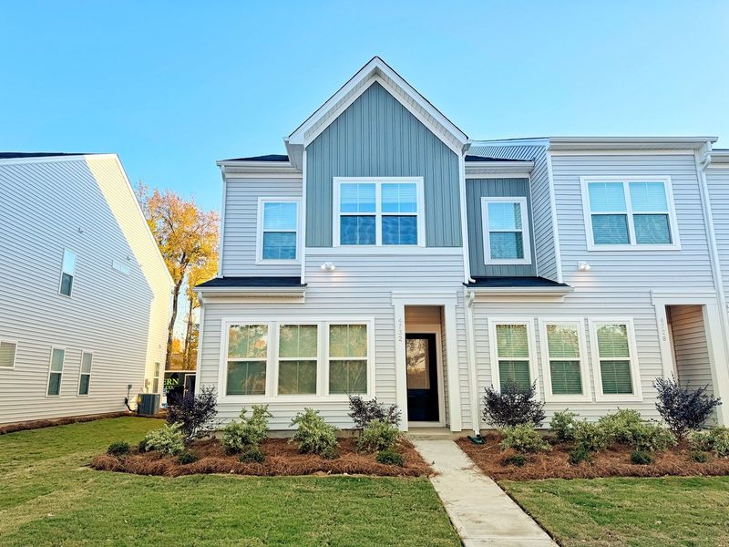 Front exterior of a new home in Lakeview Village, Charlotte, NC, highlighting curb appeal (Image 1).