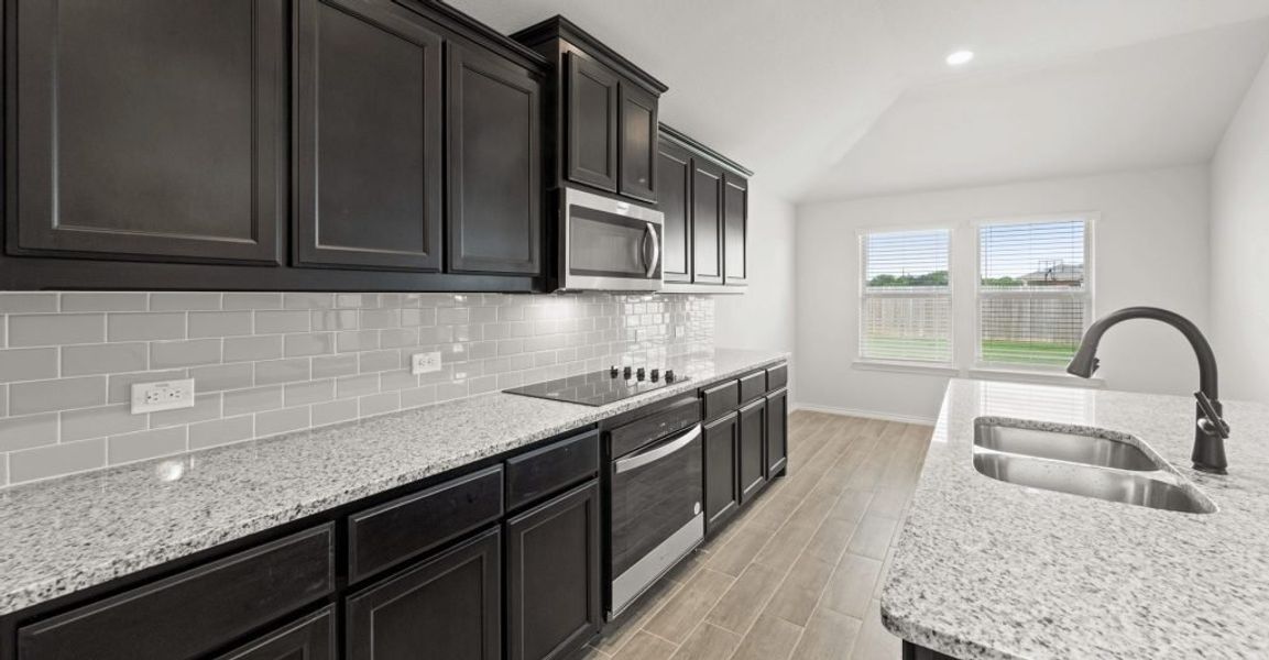 Representative exterior photo of a completed home built from the Pembridge II by Impression Homes in Mountain Valley, Burleson, TX (Image 7). Representative exterior photo of a completed home built from the Pembridge II by Impression Homes in Mountain Valley, Burleson, TX (Image 7).