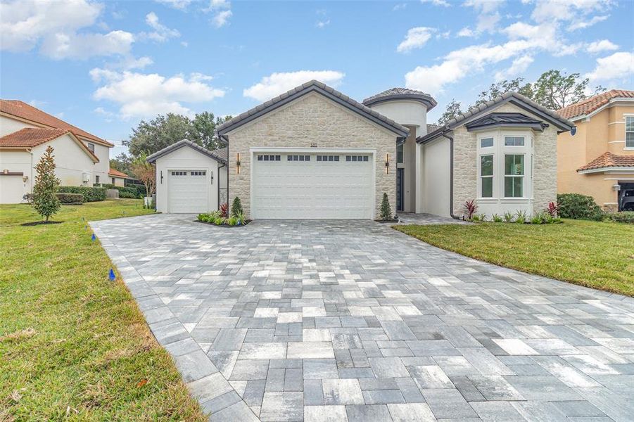 Front exterior of a new home in , Lake Mary, FL, highlighting curb appeal (Image 2). Front exterior of a new home in , Lake Mary, FL, highlighting curb appeal (Image 2).