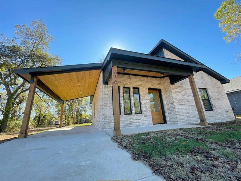 View of home's exterior featuring a carport