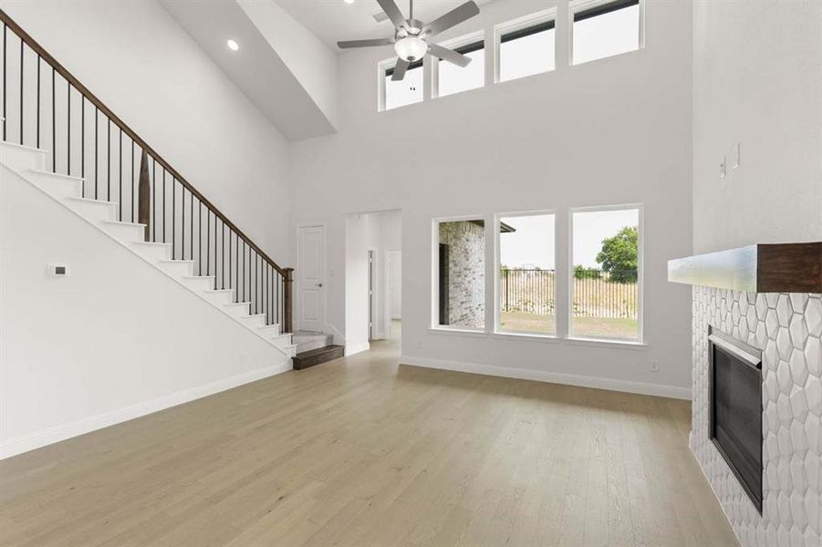 06-1020-wheatland-way-justin-tx-living-area-stairs-fireplace-timberbrook 06-1020-wheatland-way-justin-tx-living-area-stairs-fireplace-timberbrook