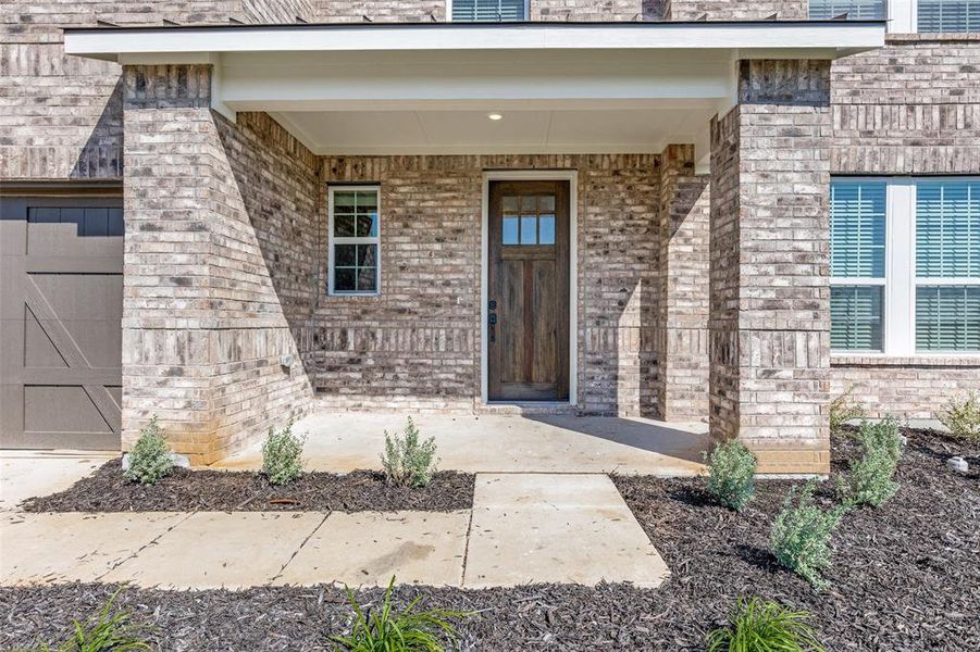 Front exterior of a new home in Sierra Vista at Kelly Ranch, Aledo, TX, highlighting curb appeal (Image 16).