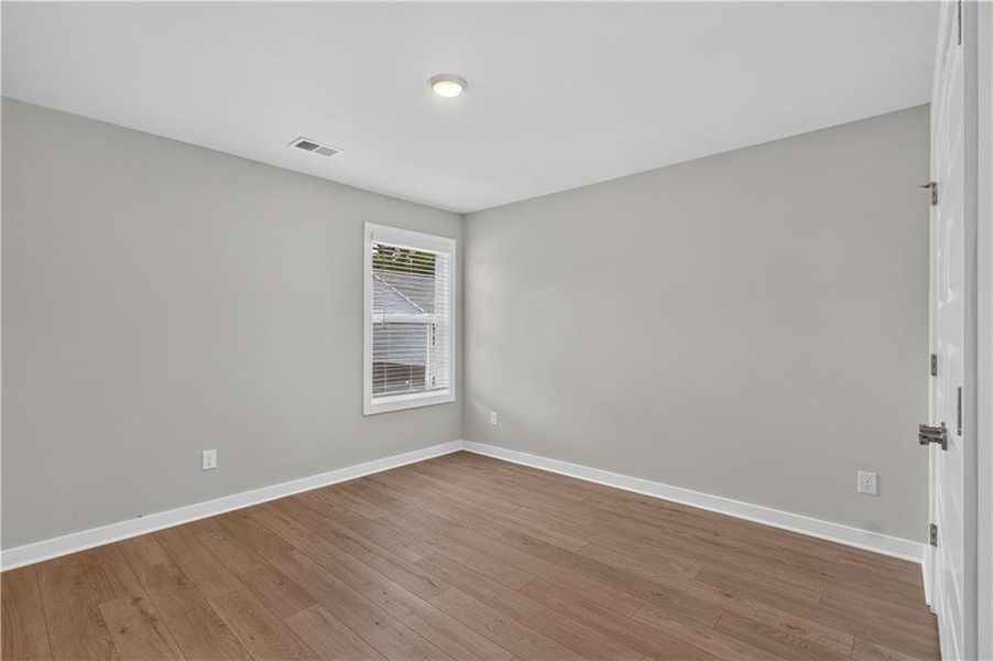 Spacious, unfurnished interior of a new home in The Cottages at East Lanier, Fayetteville (Image 10).