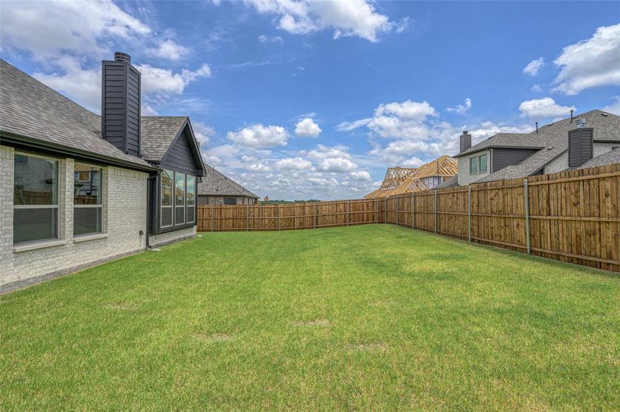 View of fenced backyard
