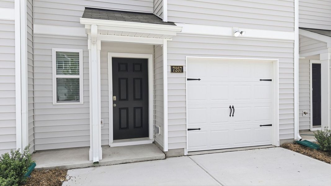 Exterior details and patio area of a home in The Townes at Hunter Hill, Rocky Mount (Image 3).