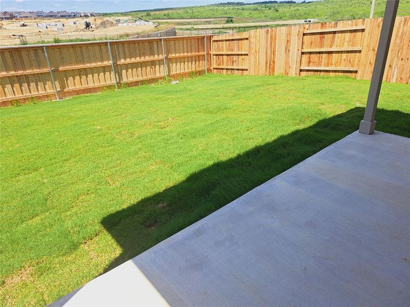 Front exterior of a new home in Sunfield, Buda, TX, highlighting curb appeal (Image 16). Front exterior of a new home in Sunfield, Buda, TX, highlighting curb appeal (Image 16).