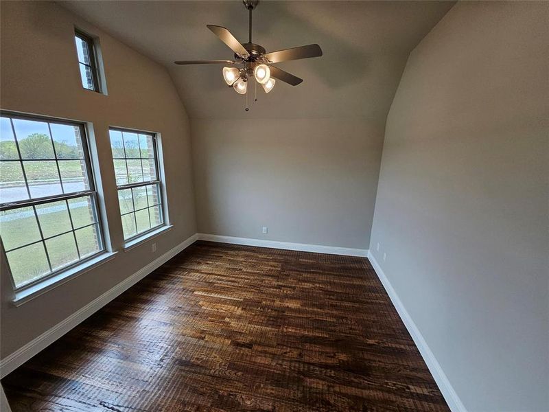 Study with French doors and ceiling fan (home does not include wood floors in study as shown in photo)