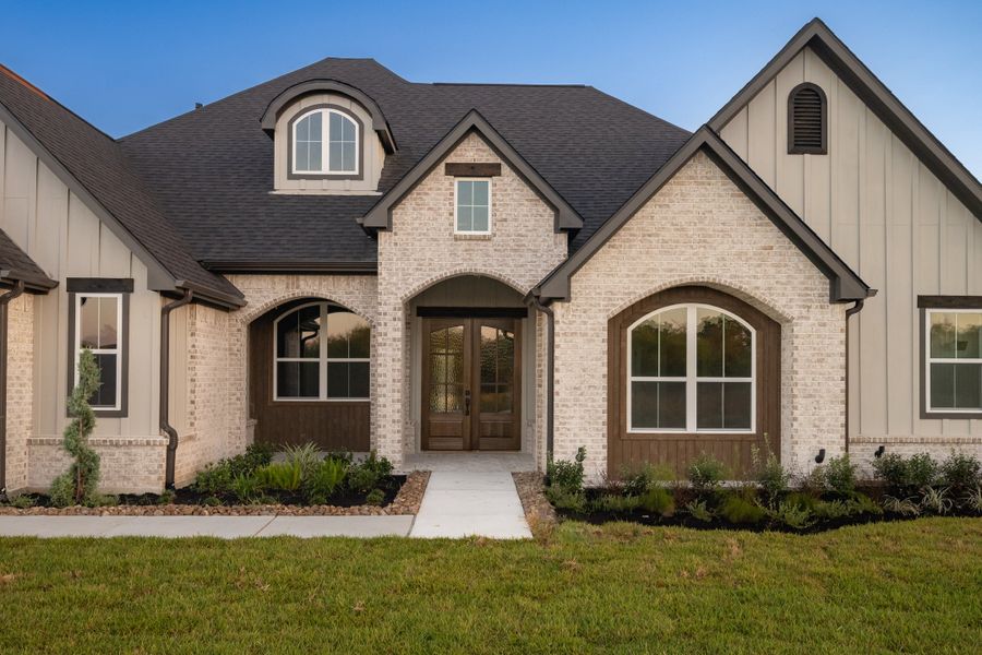 Front exterior of a new home in Windmill Hill, Bryan, TX, highlighting curb appeal (Image 28).