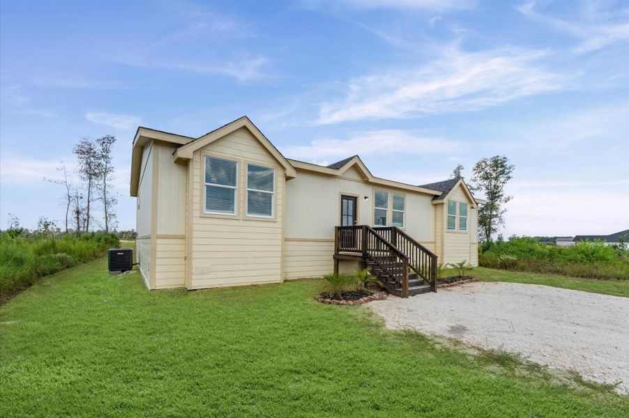 Front exterior of a new home in , Huffman, TX, highlighting curb appeal (Image 25). Front exterior of a new home in , Huffman, TX, highlighting curb appeal (Image 25).