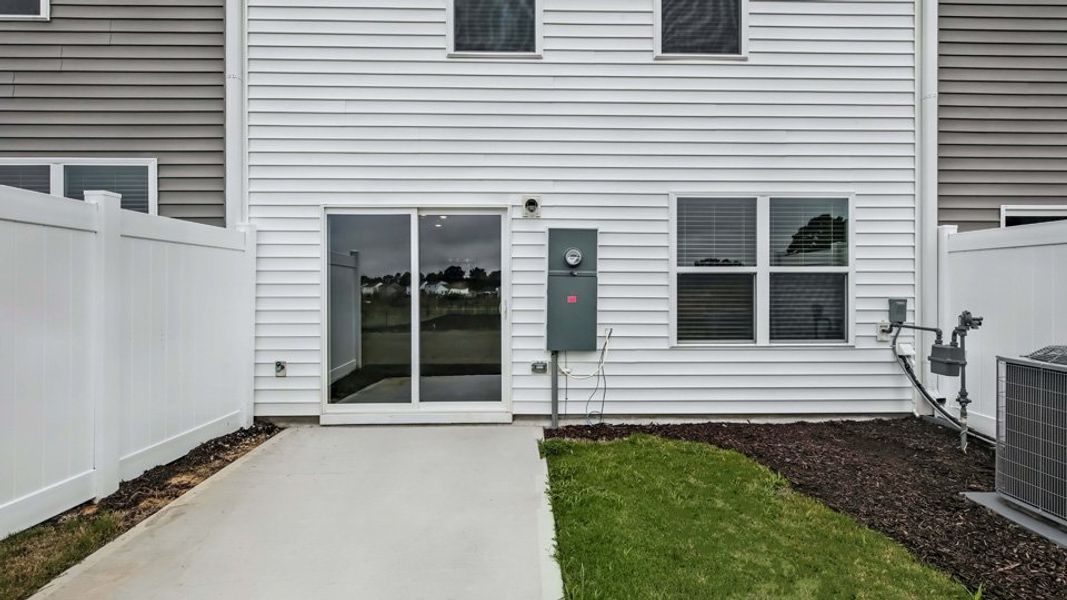 Exterior details and patio area of a home in The Townes at Honeycutt Oaks, Angier (Image 4).