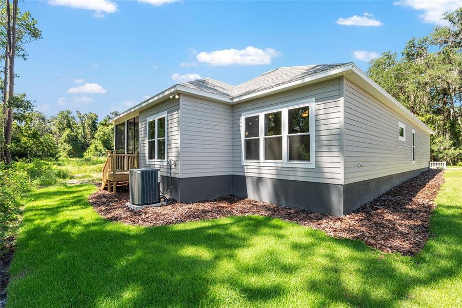 Front exterior of a new home in Fairway Pointe at West End, Newberry, FL, highlighting curb appeal (Image 26). Front exterior of a new home in Fairway Pointe at West End, Newberry, FL, highlighting curb appeal (Image 26).