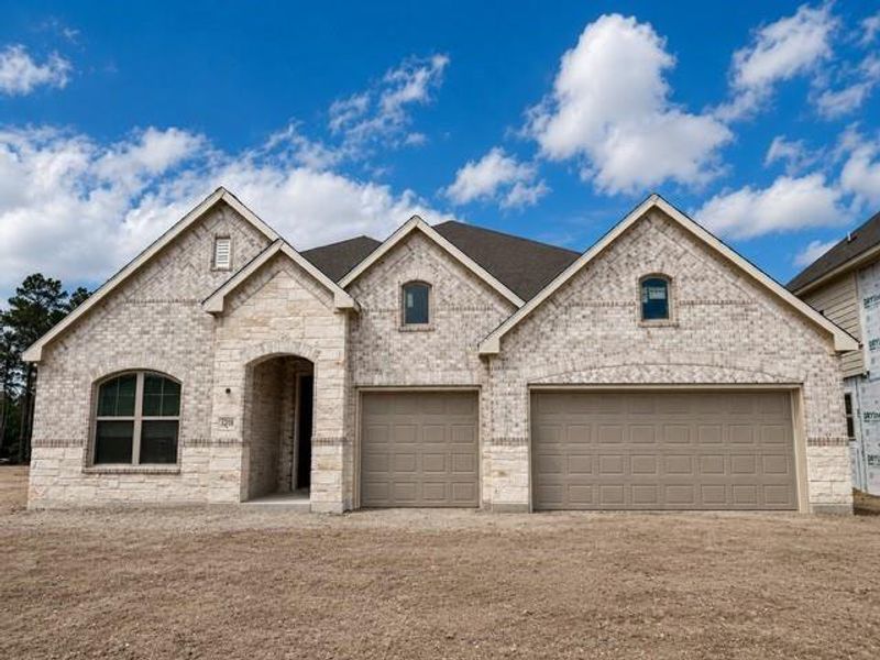 Front exterior of a new home in , Spring, TX, highlighting curb appeal (Image 12).