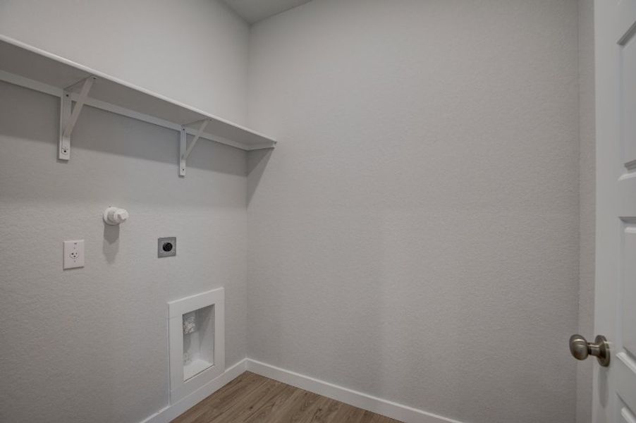 A white wall with a white door.