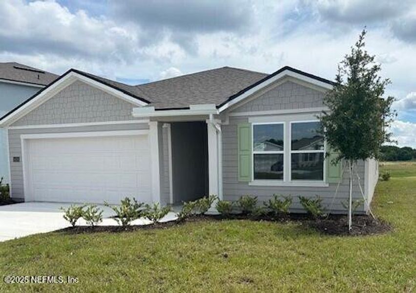 Front exterior of a new home in Rookery, Green Cove Springs, FL, highlighting curb appeal (Image 2). Front exterior of a new home in Rookery, Green Cove Springs, FL, highlighting curb appeal (Image 2).
