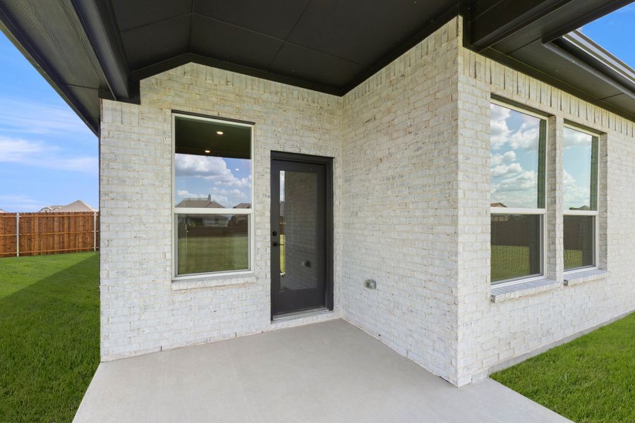 Exterior details and patio area of a home in Coyote Crossing, Godley (Image 3). Exterior details and patio area of a home in Coyote Crossing, Godley (Image 3).