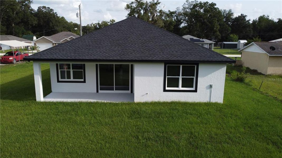 Exterior details and patio area of a home in , Summerfield (Image 30).