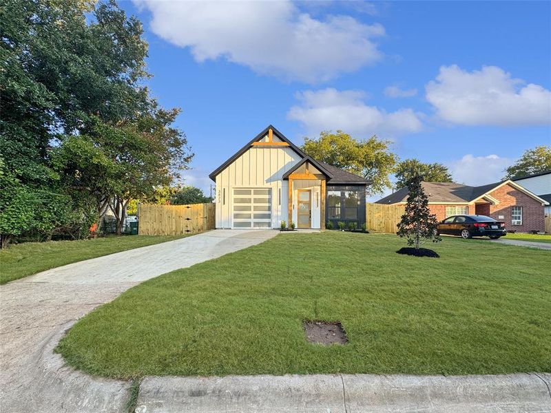 Modern farmhouse with board and batten siding and concrete driveway