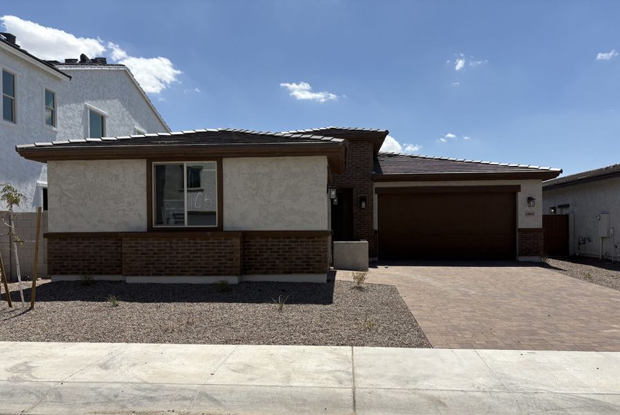 Front exterior of a new home in Harvest at Citrus Park, Goodyear, AZ, highlighting curb appeal (Image 2). Front exterior of a new home in Harvest at Citrus Park, Goodyear, AZ, highlighting curb appeal (Image 2).