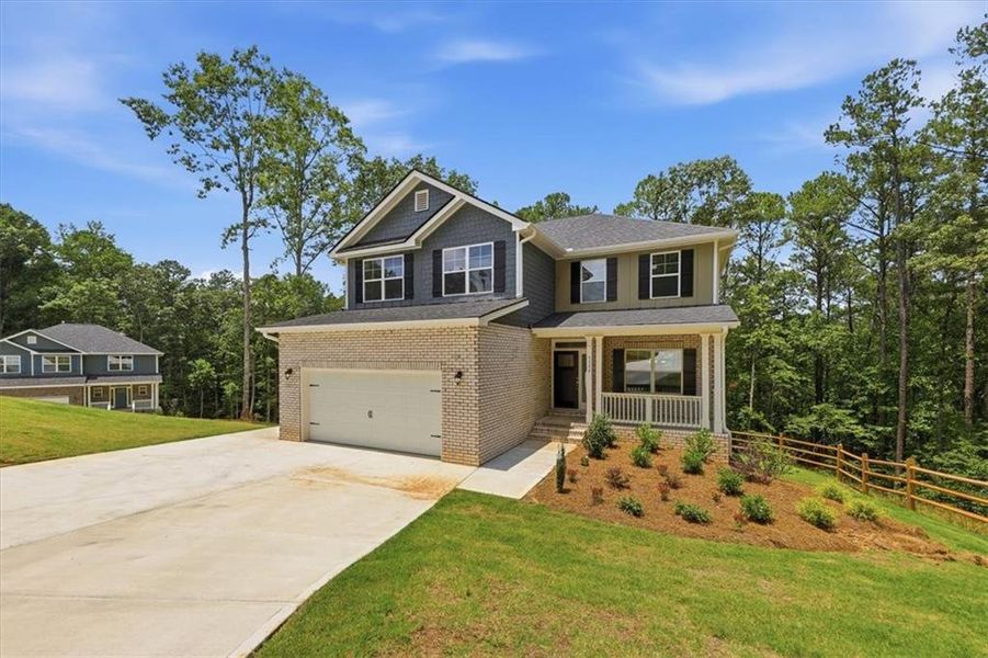 Front exterior of a new home in Tuscany Hills, Douglasville, GA, highlighting curb appeal (Image 2). Front exterior of a new home in Tuscany Hills, Douglasville, GA, highlighting curb appeal (Image 2).
