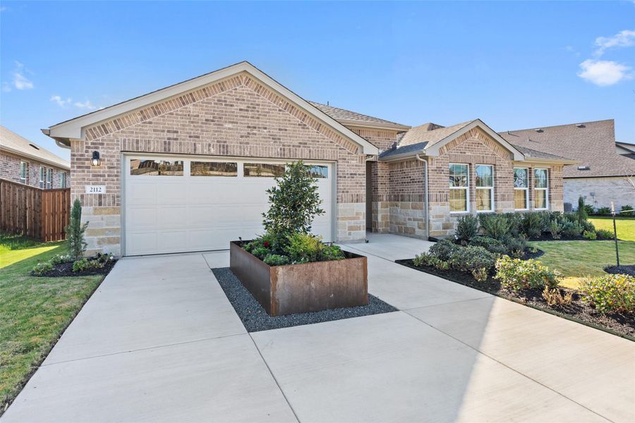 Front exterior of a new home in Riverview, Georgetown, TX, highlighting curb appeal (Image 21). Front exterior of a new home in Riverview, Georgetown, TX, highlighting curb appeal (Image 21).