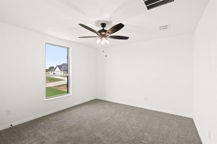 Carpeted empty room with baseboards Carpeted empty room with baseboards