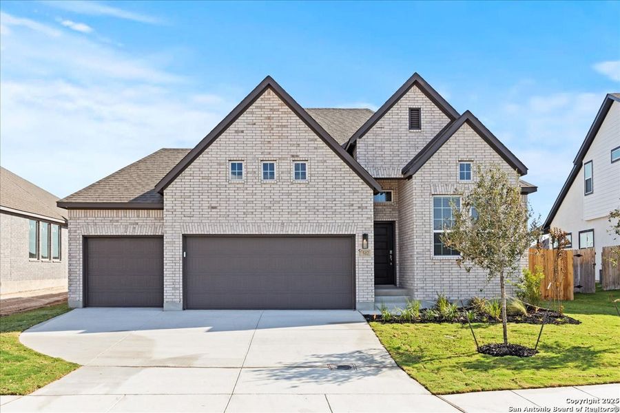 Front exterior of a new home in Village at Three Oaks, Seguin, TX, highlighting curb appeal (Image 17). Front exterior of a new home in Village at Three Oaks, Seguin, TX, highlighting curb appeal (Image 17).