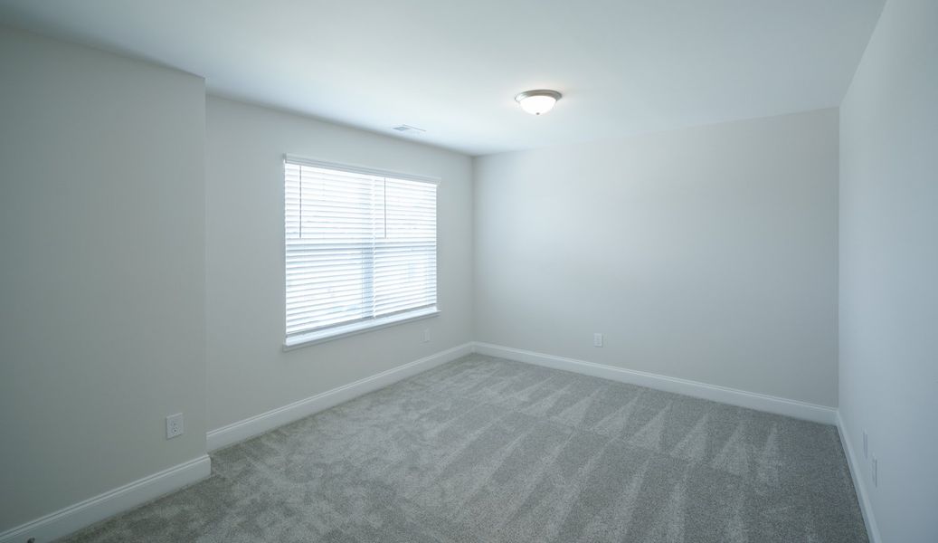 Representative unfurnished interior of a home built from the The McKee by Cothran Homes in Holly Ridge, Greenville (Image 34). Representative unfurnished interior of a home built from the The McKee by Cothran Homes in Holly Ridge, Greenville (Image 34).