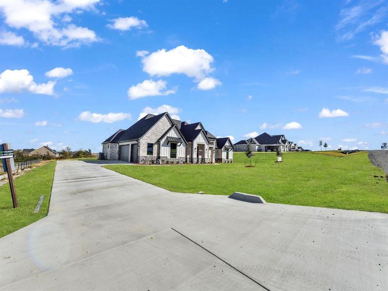 Front exterior of a new home in , Weatherford, TX, highlighting curb appeal (Image 27).