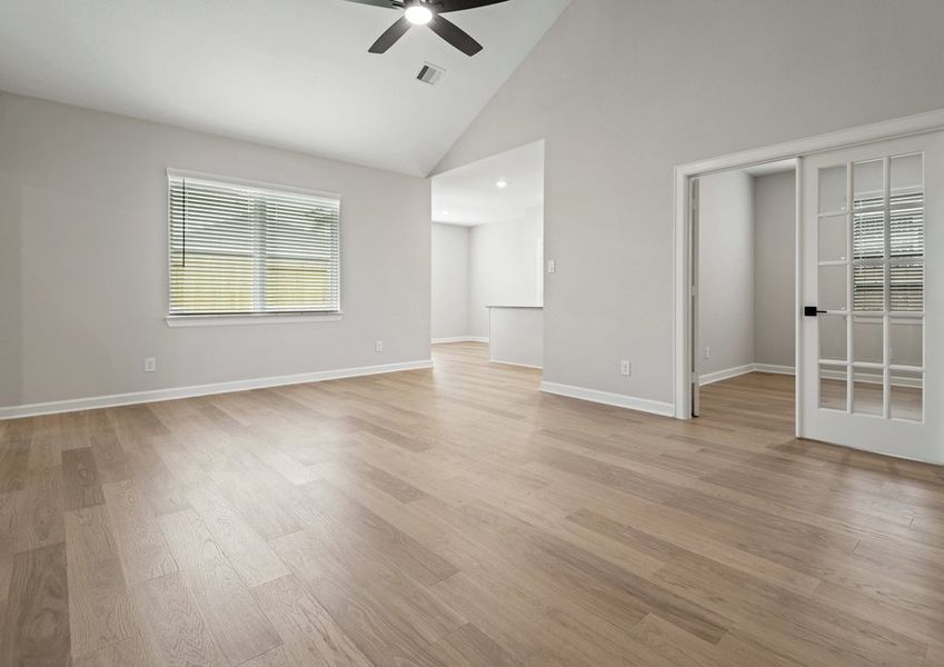 Angled view of the family room with a window view of the backyard