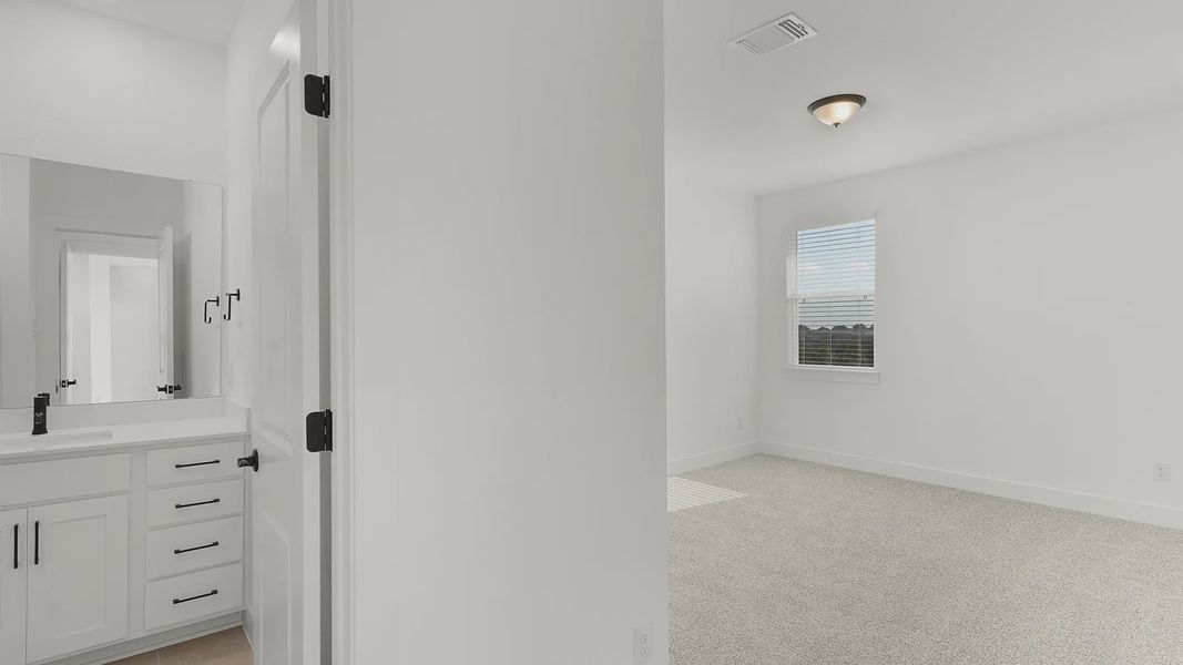 Representative unfurnished interior of a home built from the Cornell by Chesmar Homes in Crescent Bluff, Georgetown (Image 19).