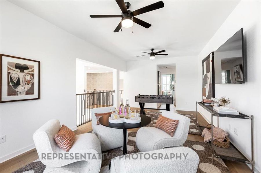 Dining space featuring wood finished floors and a ceiling fan Dining space featuring wood finished floors and a ceiling fan
