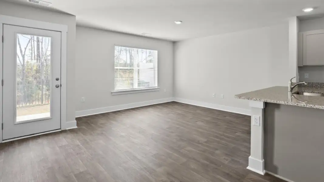 Spacious, unfurnished interior of a new home in The Townes at Cedar Hill Landing, Navassa (Image 13).