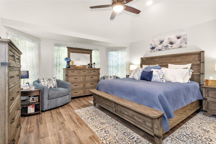Welcome to your Primary Suite located just off the kitchen in the back of the home. Notice the wall of windows and all of the ceiling details in this room. Welcome to your Primary Suite located just off the kitchen in the back of the home. Notice the wall of windows and all of the ceiling details in this room.