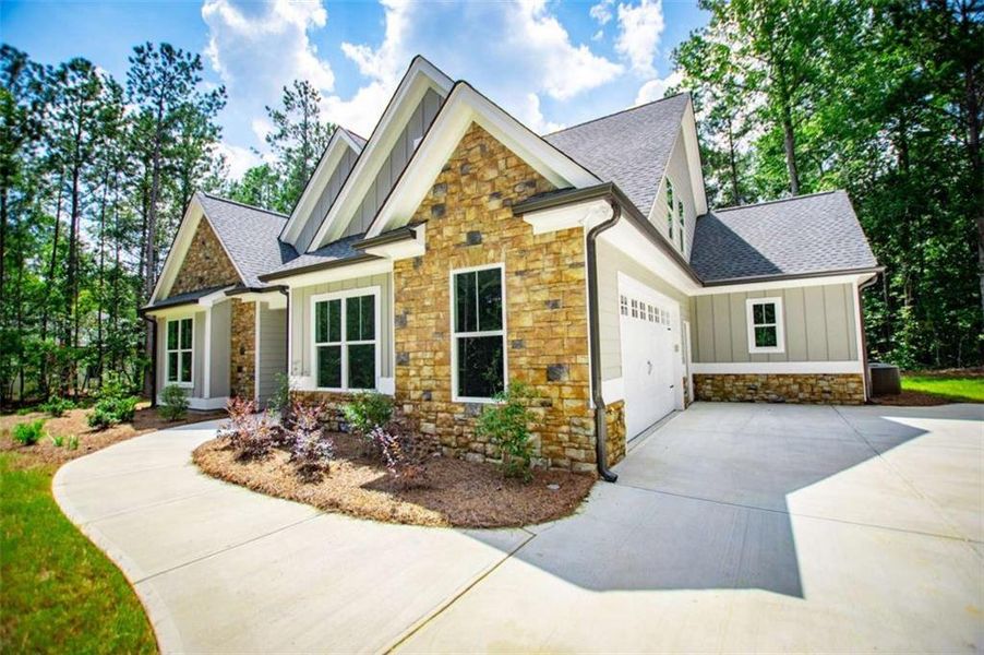 Front exterior of a new home in , Douglasville, GA, highlighting curb appeal (Image 31).