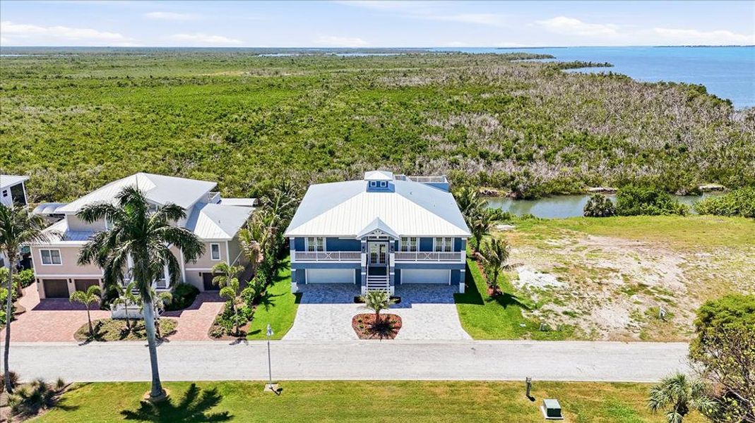 Front exterior of a new home in , Placida, FL, highlighting curb appeal (Image 29).