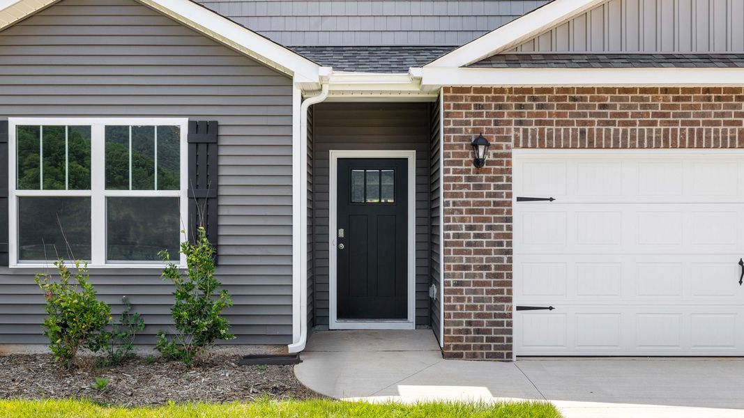 Exterior details and patio area of a home in Valleywood Farms, Waynesville (Image 3).