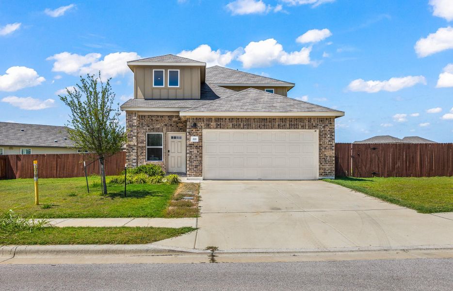 View of front of property featuring brick siding, concrete driveway, a shingled roof, board and batten siding, and a garage View of front of property featuring brick siding, concrete driveway, a shingled roof, board and batten siding, and a garage