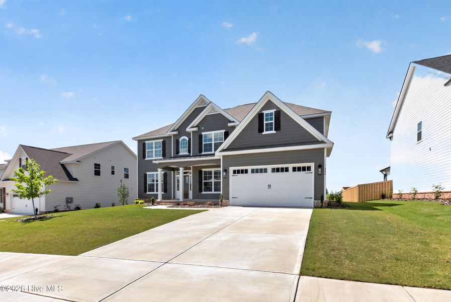 Front exterior of a new home in Highland Lakes, Evans, GA, highlighting curb appeal (Image 25).