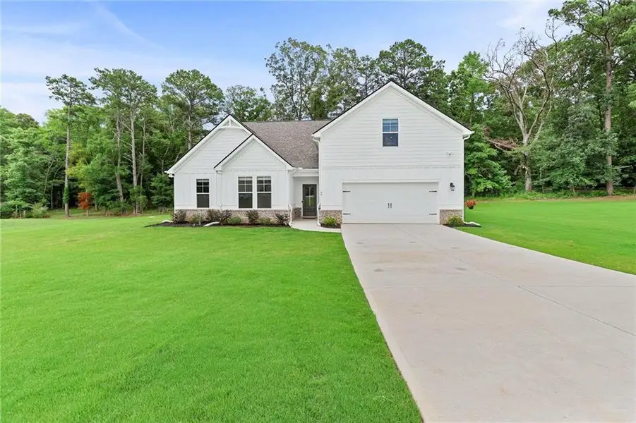Front exterior of a new home in , Moreland, GA, highlighting curb appeal (Image 1). Front exterior of a new home in , Moreland, GA, highlighting curb appeal (Image 1).