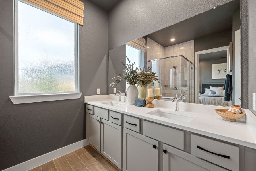 Representative furnished interior of a home built from the Bonneville by Chesmar Homes in University Heights, Round Rock (Image 11).