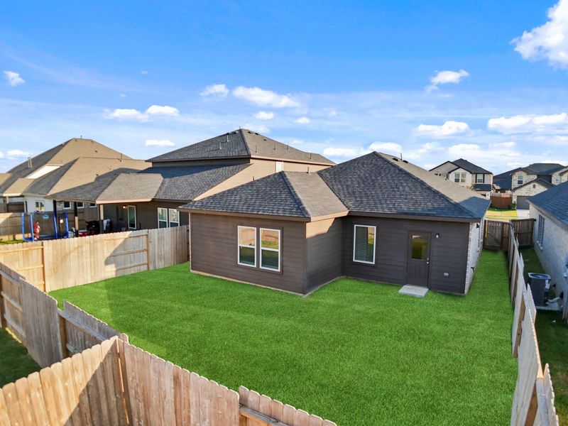 A look at the spacious backyard from above highlights the generous green space, ideal for outdoor entertaining, gardening, furry friends and more!