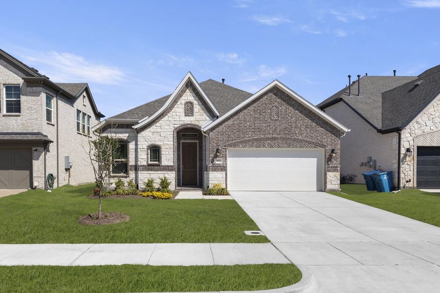 Front exterior of a new home in Lake Shore Village, Rowlett, TX, highlighting curb appeal (Image 1). Front exterior of a new home in Lake Shore Village, Rowlett, TX, highlighting curb appeal (Image 1).