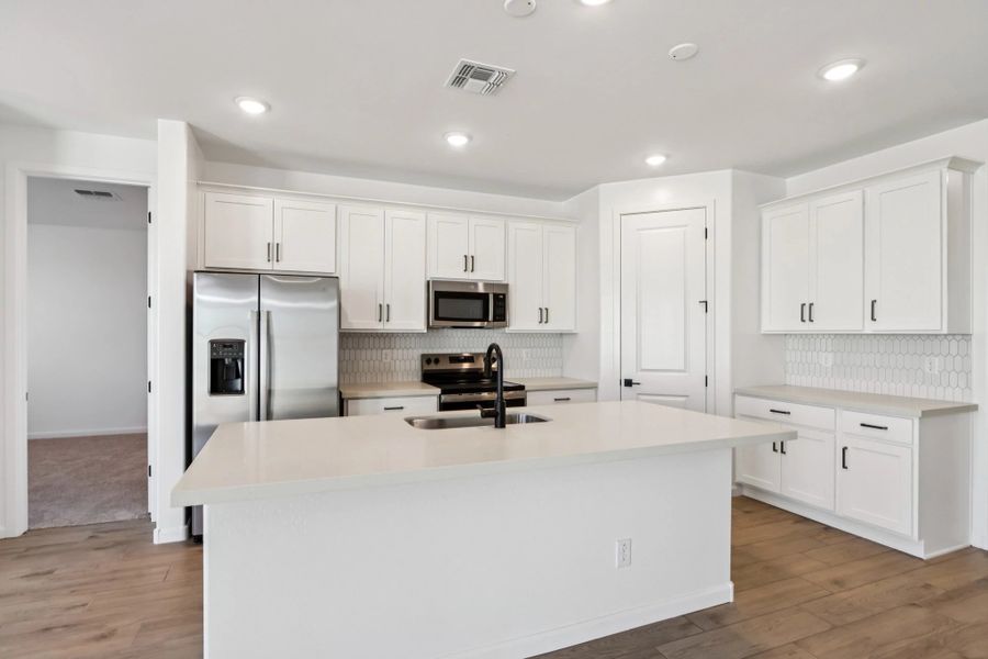 Kitchen featuring the Harmony Collection. Not actual home, finishes may vary by community. Kitchen featuring the Harmony Collection. Not actual home, finishes may vary by community.