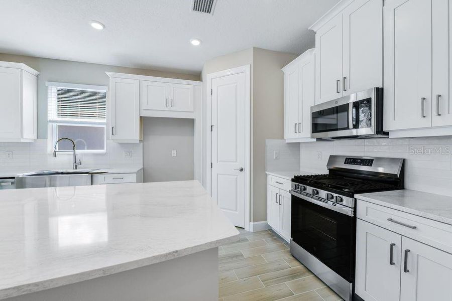 Furnished interior view inside a new home in Esplanade at Skye Ranch, Sarasota (Image 9).